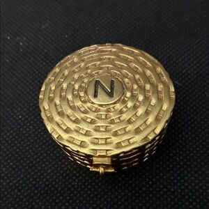 Vintage Norell solid perfume & after empty.Great pillbox. Goldtone with N on top